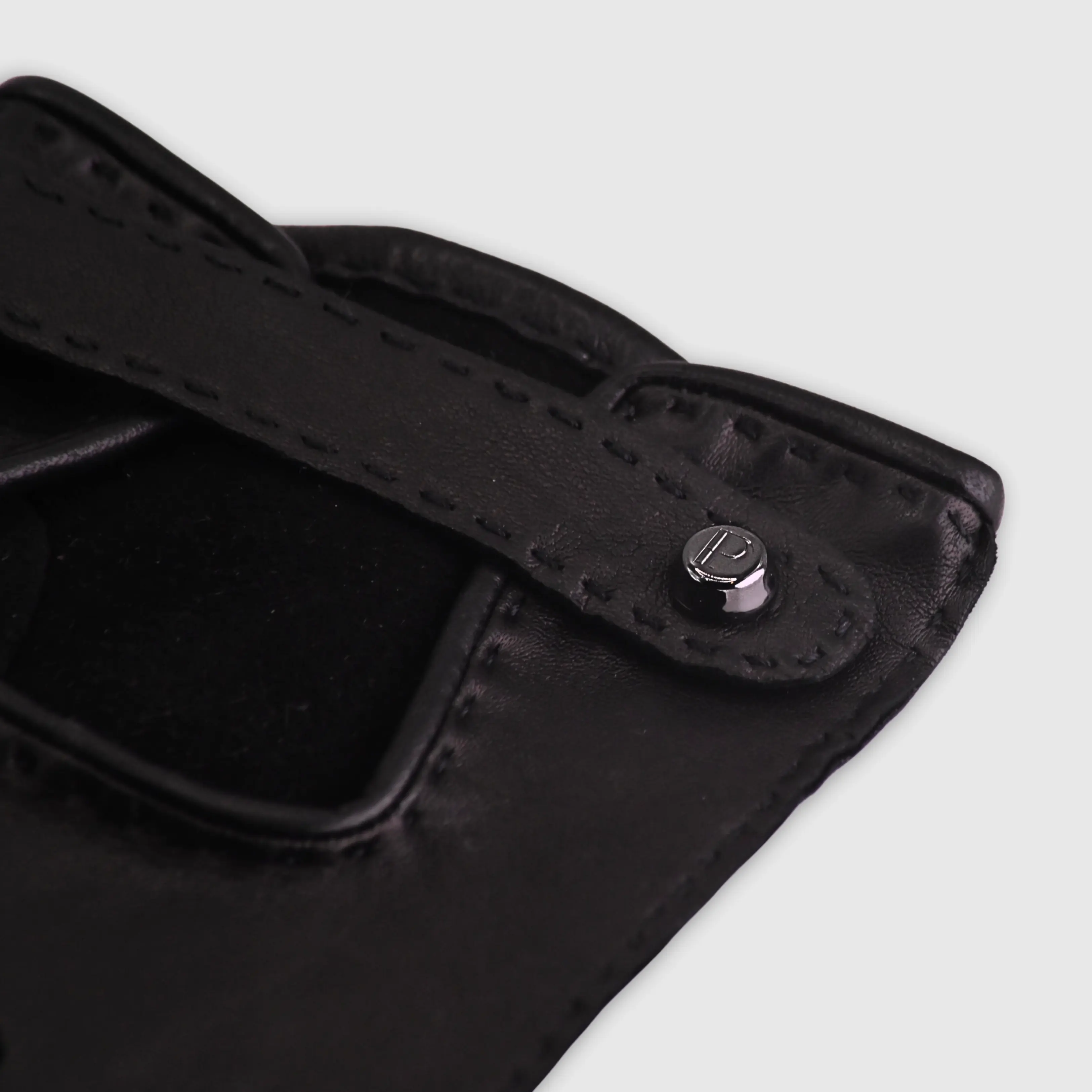 Handcrafted from smooth caramel lambskin and lined with natural beige cashmere. Finished with a decorative, hand-stitched leather strap in contrasting beige thread. Featuring the signature brass logo closure in silver, nickel-free and protected with a durable, polished finish. Made in an artisanal workshop in Italy. Available in sizes 7, 7.5, 8, 8.5, 9, 9.5 (Italian sizing).